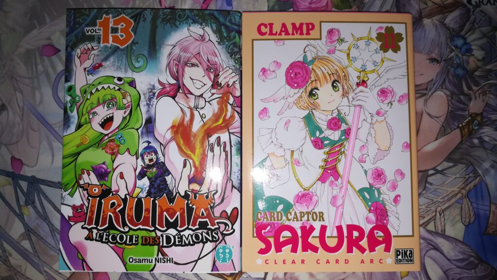 Couvertures du tome 13 de Iruma à l'Ecole des Démons et du tome 11 de Card Captor Sakura Clear Card Arc