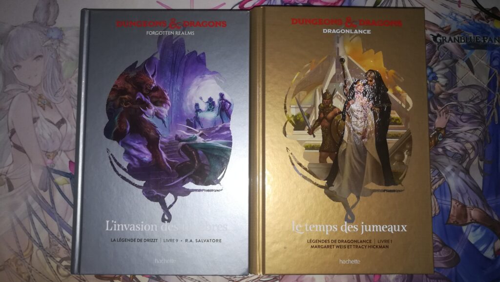 Photo des 2 tomes Donjons & Dragons du mois : L'invasion des ténèbres (Forgotten Realms, La Légende de Drizzt Livre 9) et Le temps des jumeaux (Dragonlance, Légendes de DragonLance Livre 1).